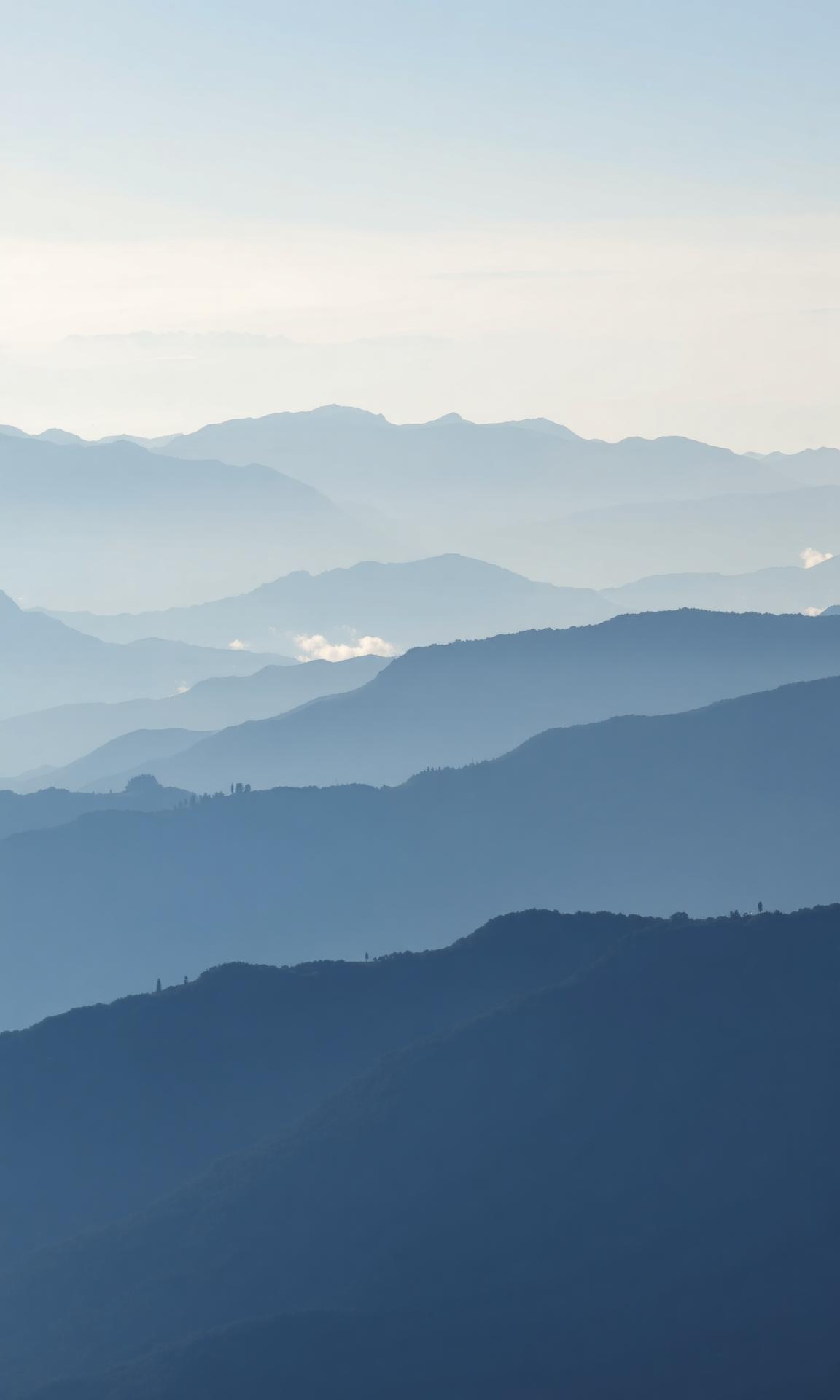 Mountain ridges under a clear morning sky